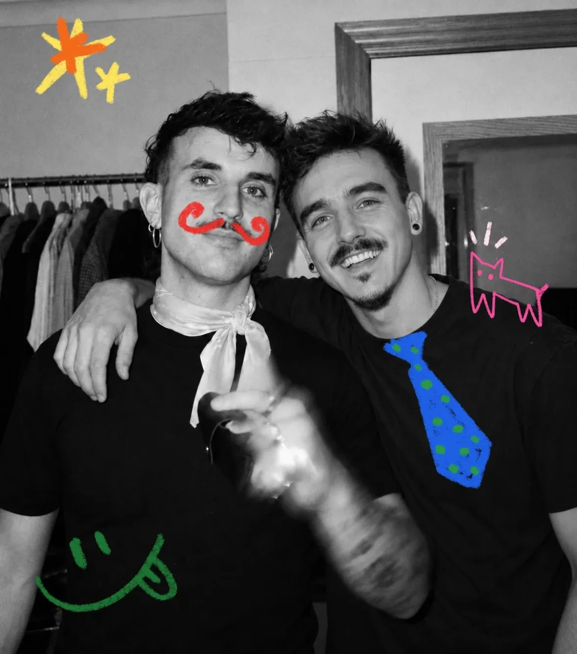 Dani and Jorge, the two tattoo artists behind Ay, Nena!, arm in arm and smiling